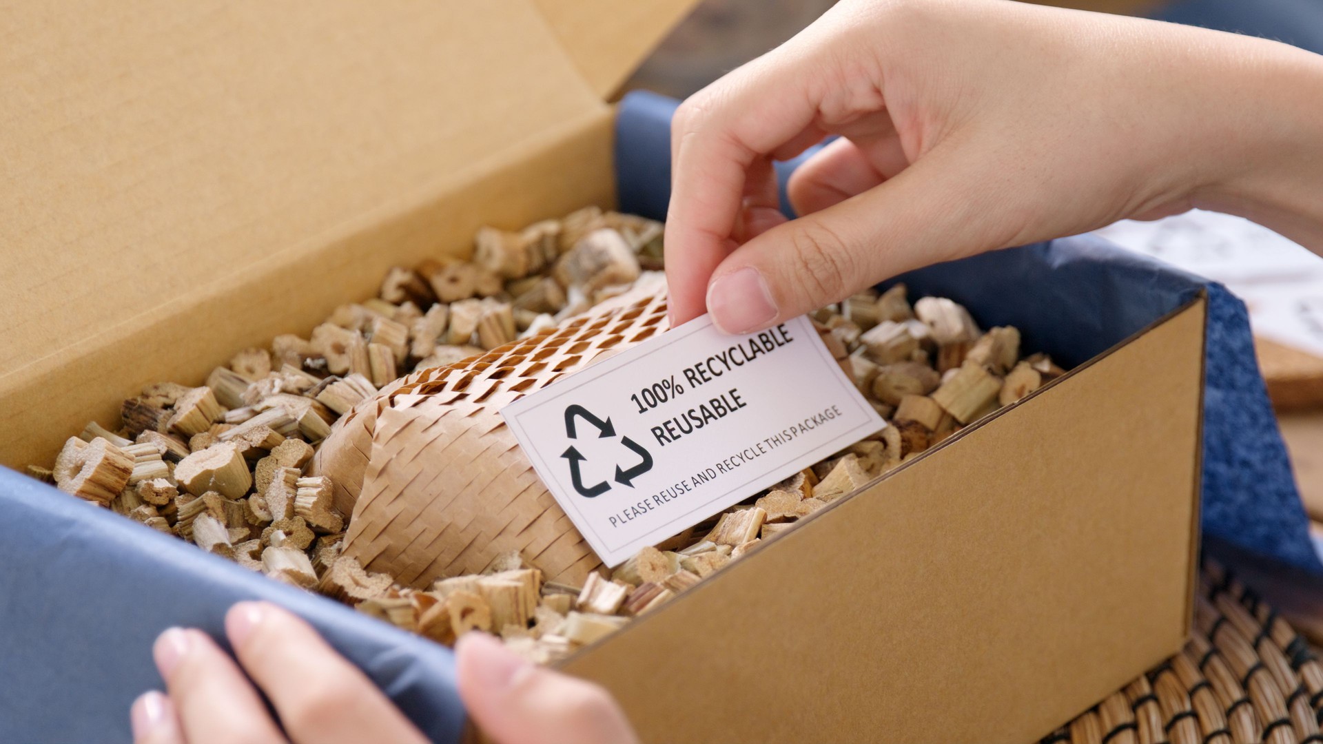 Eco vendor go green packaging parcel carton box in net zero waste store asian seller retail shop. Earth care day small SME owner asia people wrap reuse brown paper pack gift reduce plastic free order.